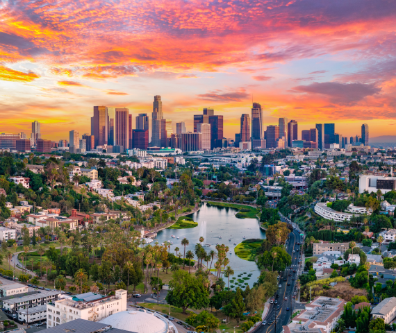 Aerial view of the Los Angeles city skyline at sunset.